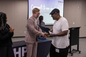 CJ Page receiving his certificate.